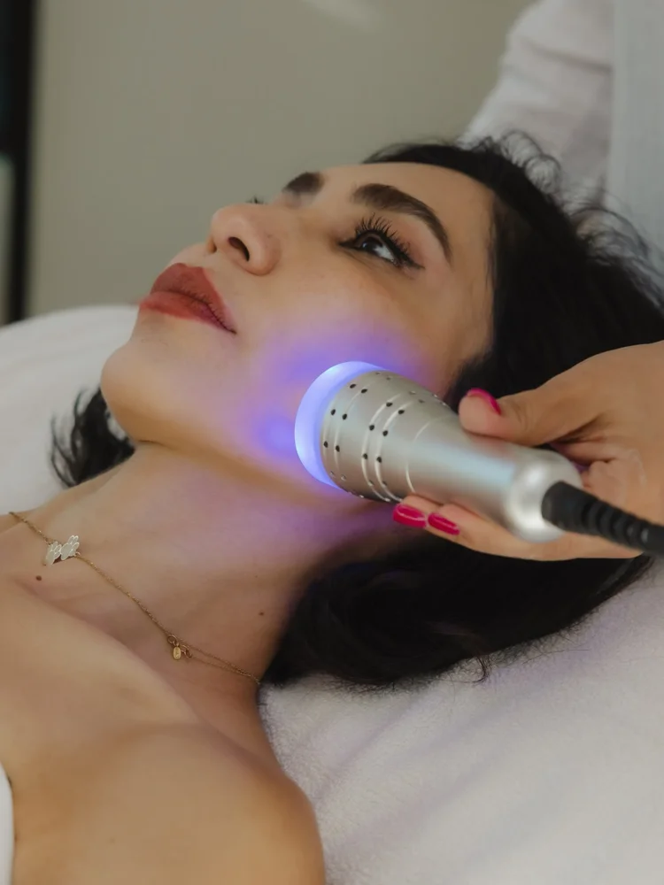 Facial treatment with a device